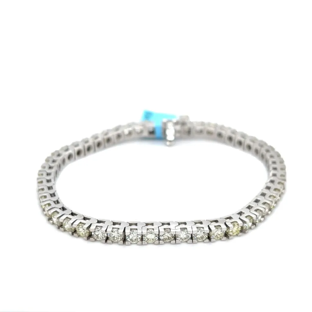 7.02 CTTW NATURAL DIAMOND TENNIS BRACELET SET IN 14 KARAT WHITE GOLD AT REGARD JEWELRY IN AUSTIN,